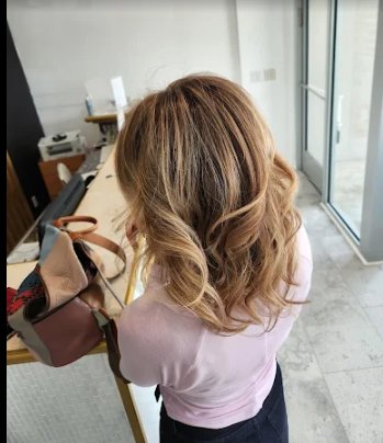Stylist working on highlighted hair.
